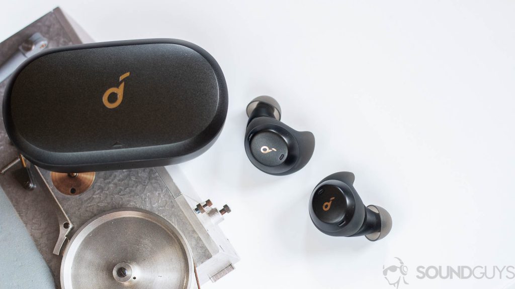 Anker Soundcore Spirit Dot 2 earbuds pictured outside of the case on a book