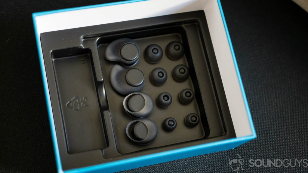Pictured are the numerous ear tips and wing stabilizers that come in the box.