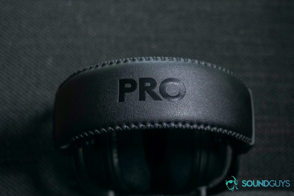 The Logitech G Pro X Wireless lays on a fabric surface showing its headband. 