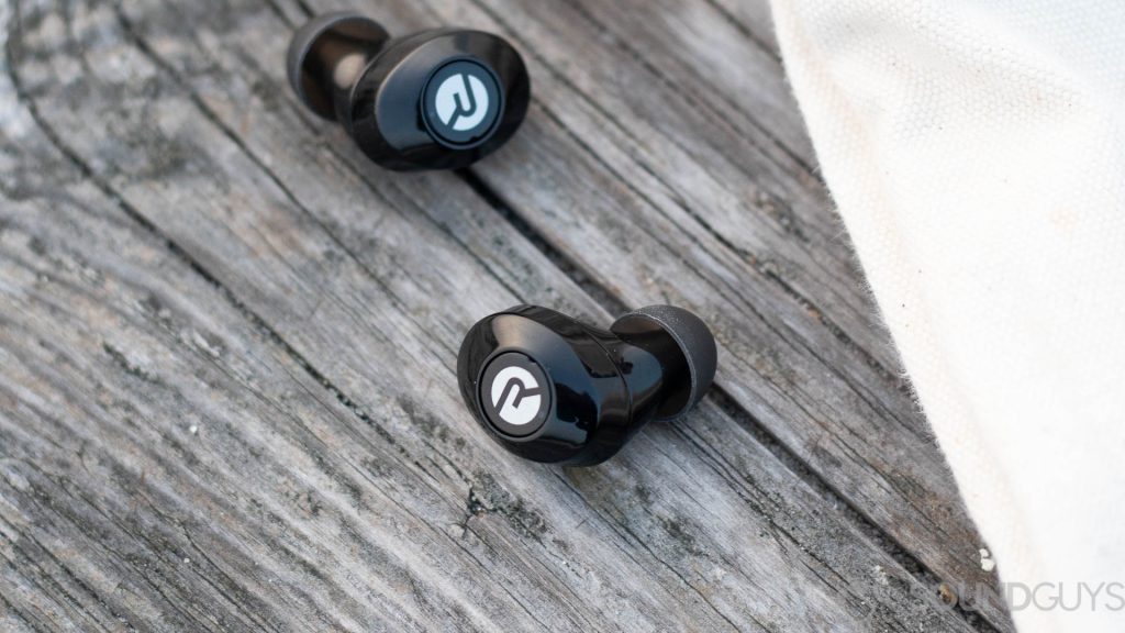 Pictured are the Raycon E25 earbuds on a wooden surface. 