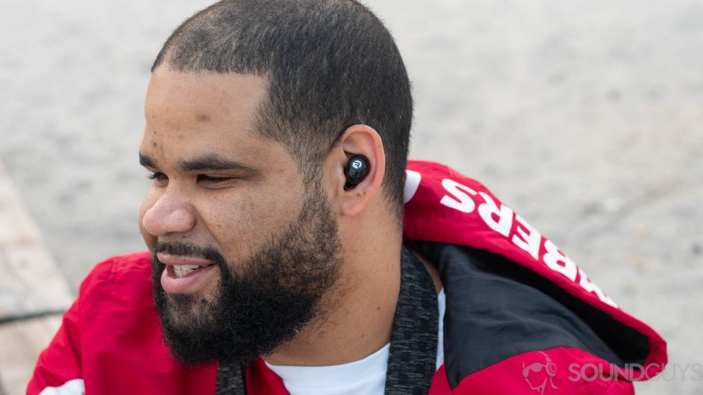 Man wearing the Raycon E25 earbuds. 