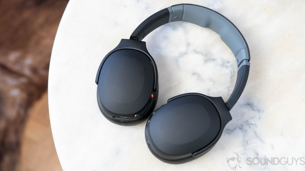 Skullcandy Crusher Evo headphones flat on marble table.