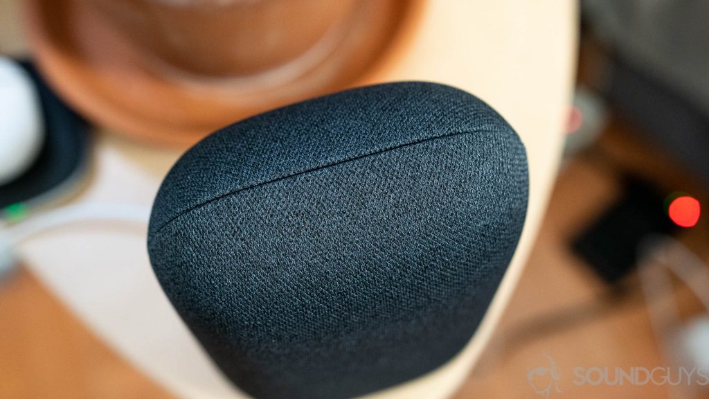 Pictured is the gray Google Nest Audio fabric stitching on a bedside table