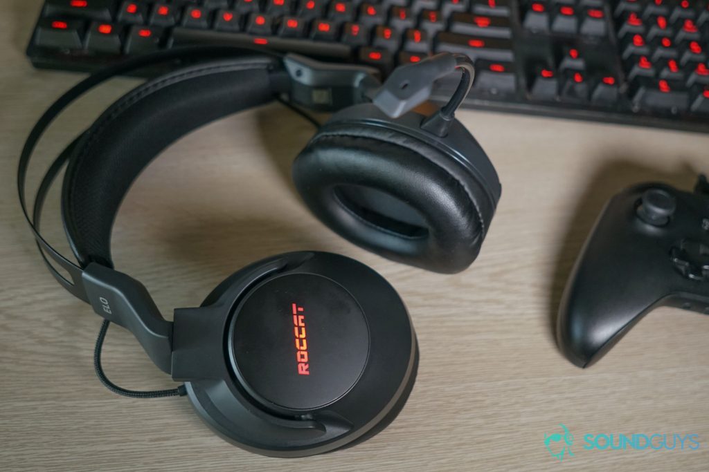 The Roccat Elo 7.1 Air lays in front of a Logitech G413 Carbon gaming keyboard and an Xbox One controller on a desk.