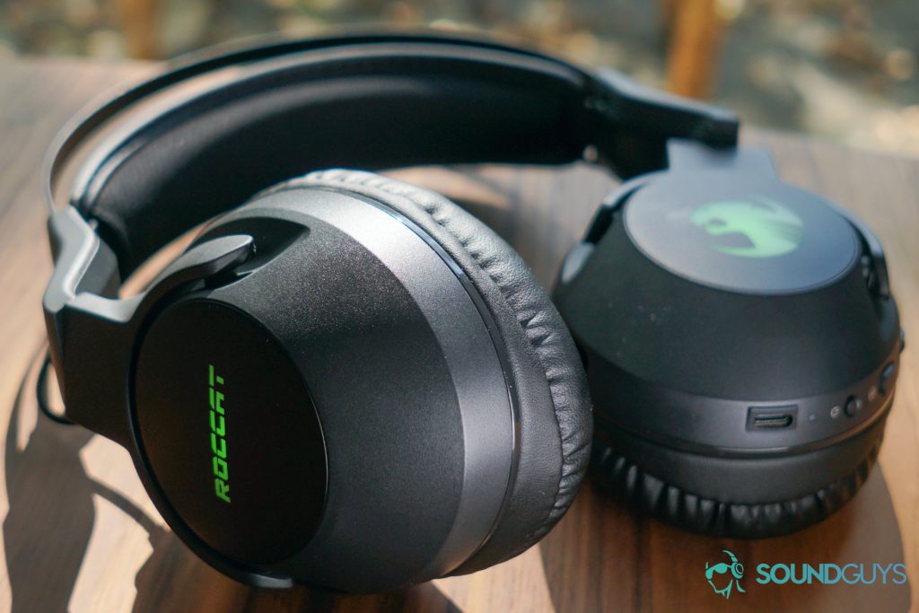 The Roccat Elo 7.1 Air lays flat on a wooden table in front of a window, with its USB-C port in view