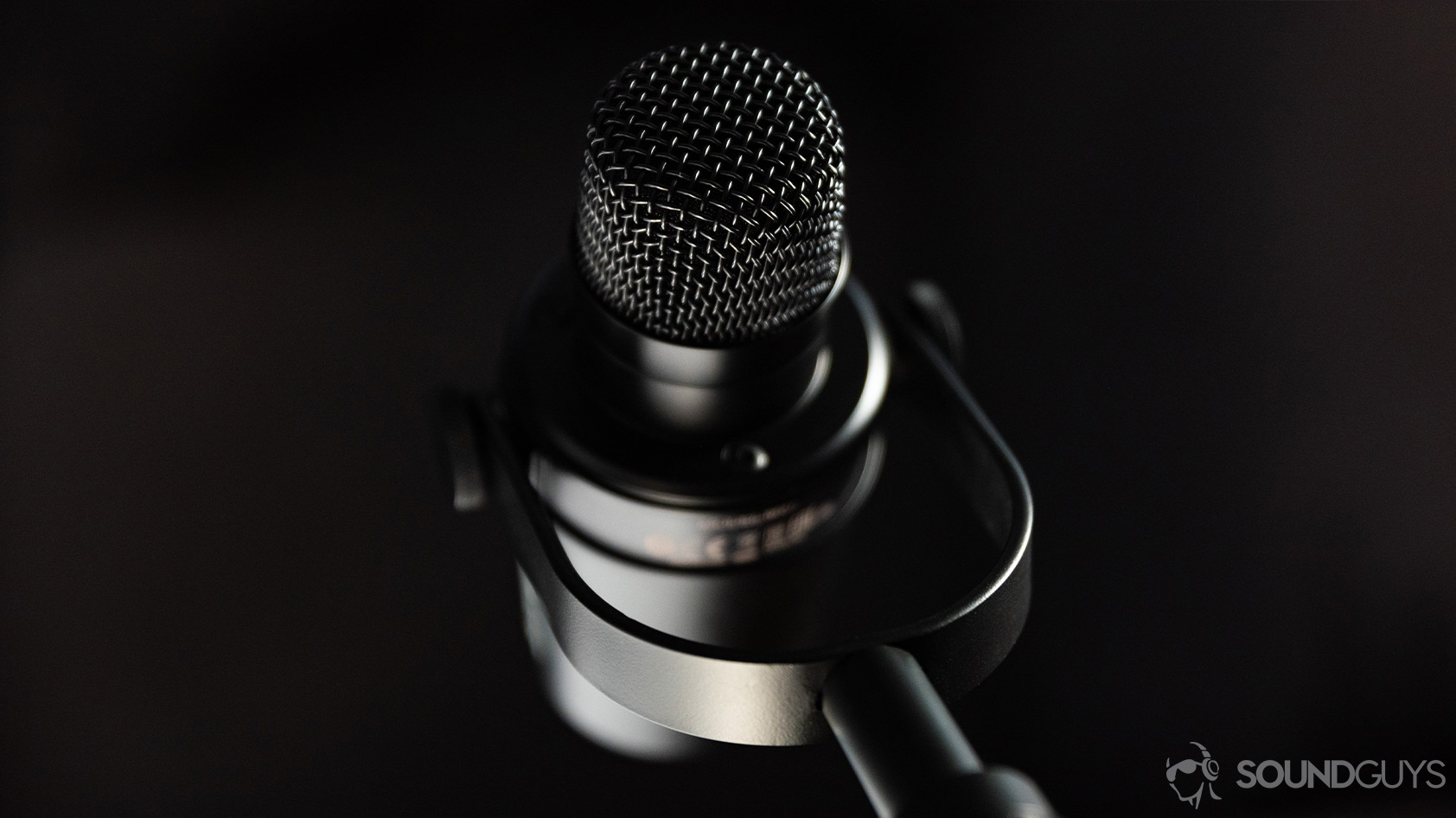The Shure MV7 USB microphone without the windscreen installed to reveal the recording capsule.