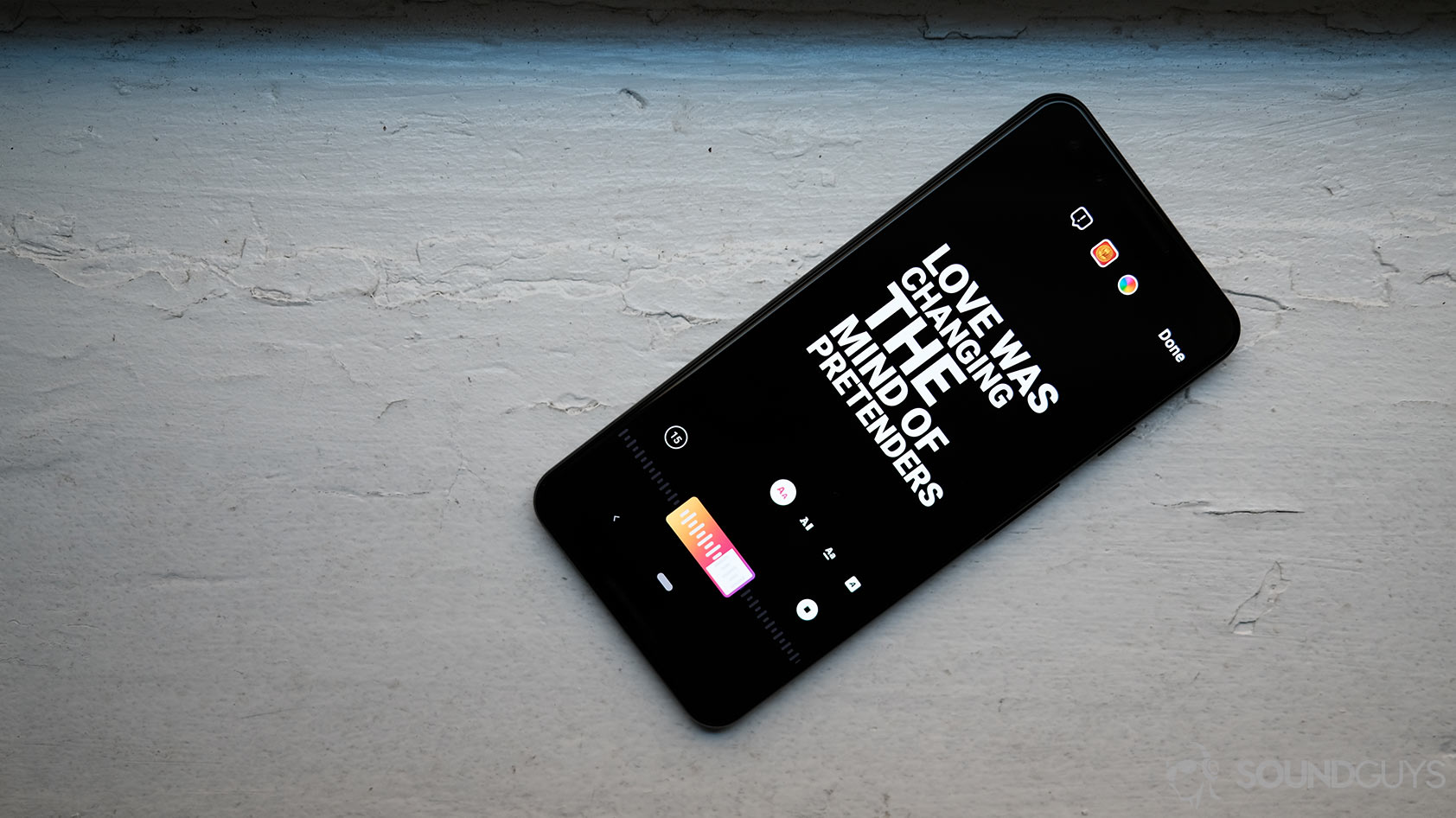 A Google Pixel 3 smartphone displays the Instagram stories feature song lyrics.