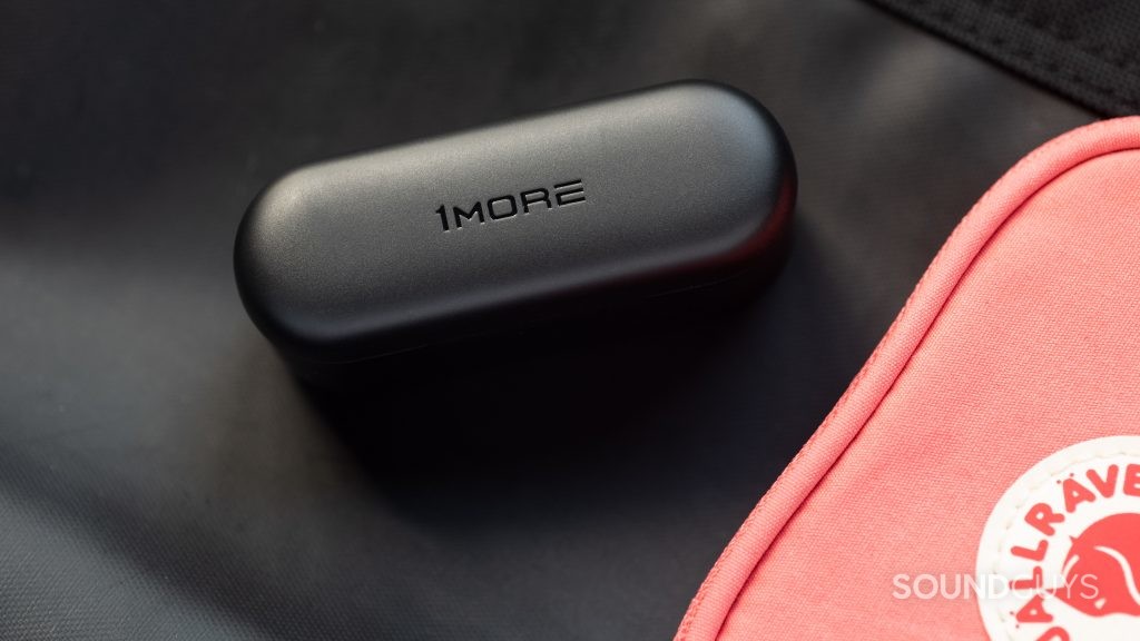 The 1MORE PistonBuds cheap true wireless earbuds charging case with the 1MORE logo on the top lid.