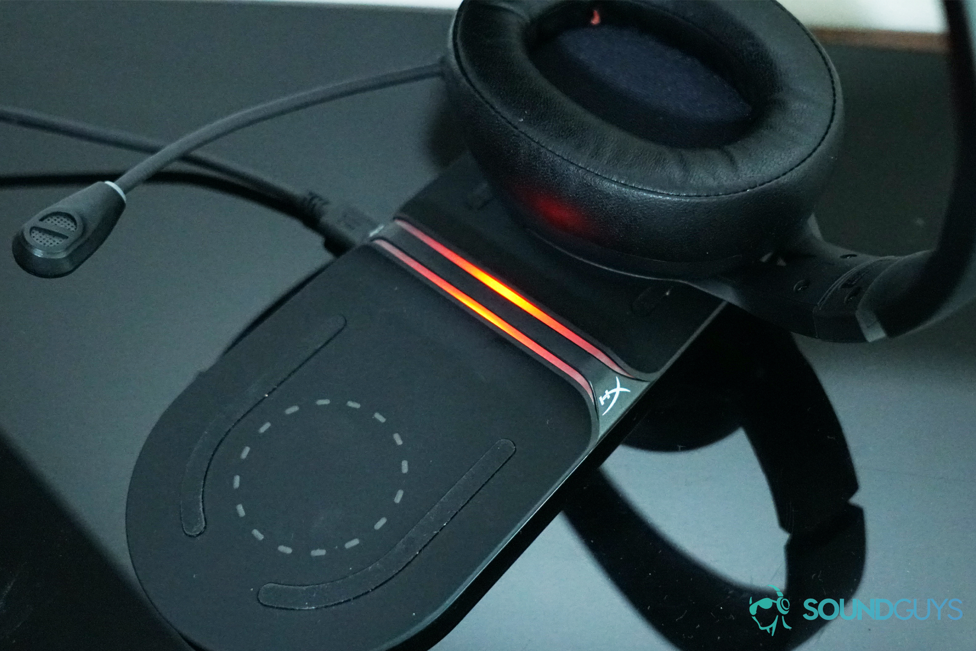 The HyperX Cloud Flight S sits on the HyperX Qi-compatible wireless charging base.