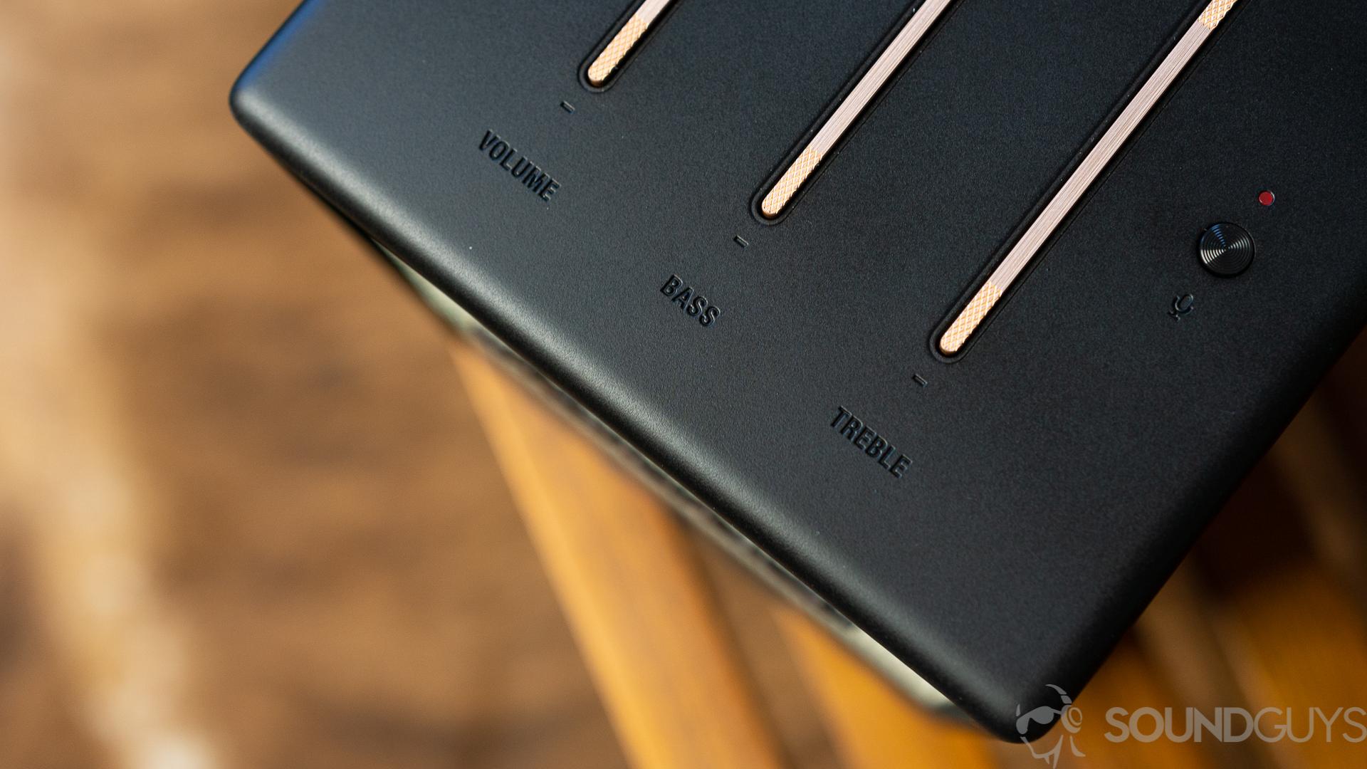 Close-up of the volume, bass, and treble labels on top of the Marshall Uxbridge Voice speaker