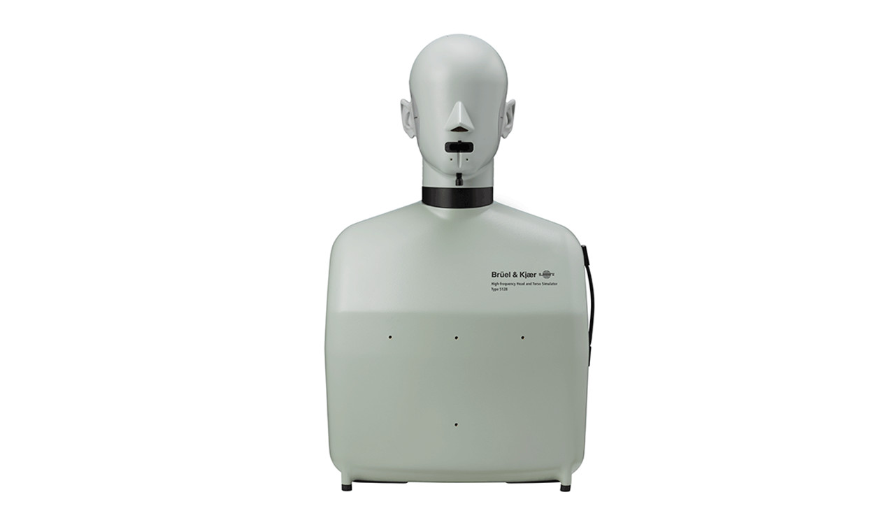 A phtoo of the Bruel &amp; Kjaer 5128 head and torso simulator, facing the viewer with its cold, unseeing stare.