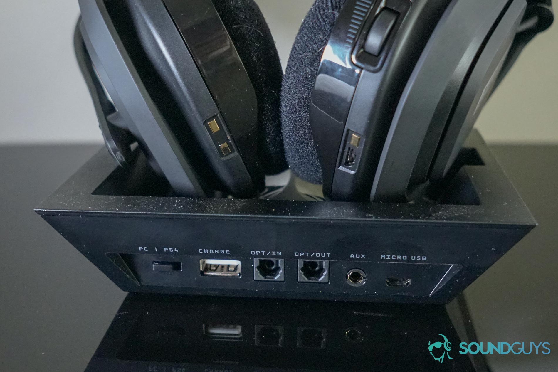 The Astro A50 sits on its base station, with their ports visible.