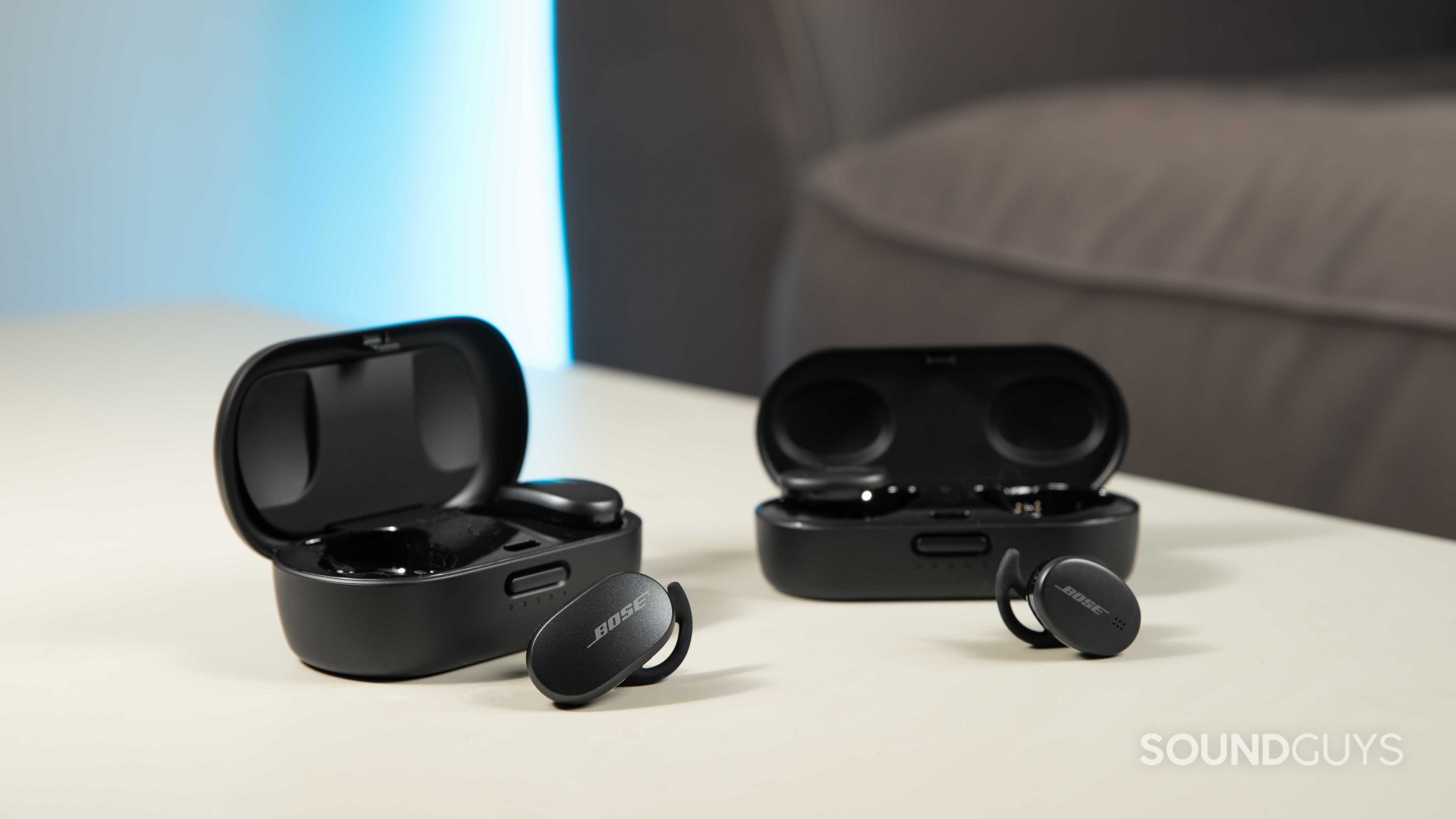 The Bose QuietComfort Earbuds noise canceling true wireless earbuds next to the Bose Sport Earbuds for a size comparison.
