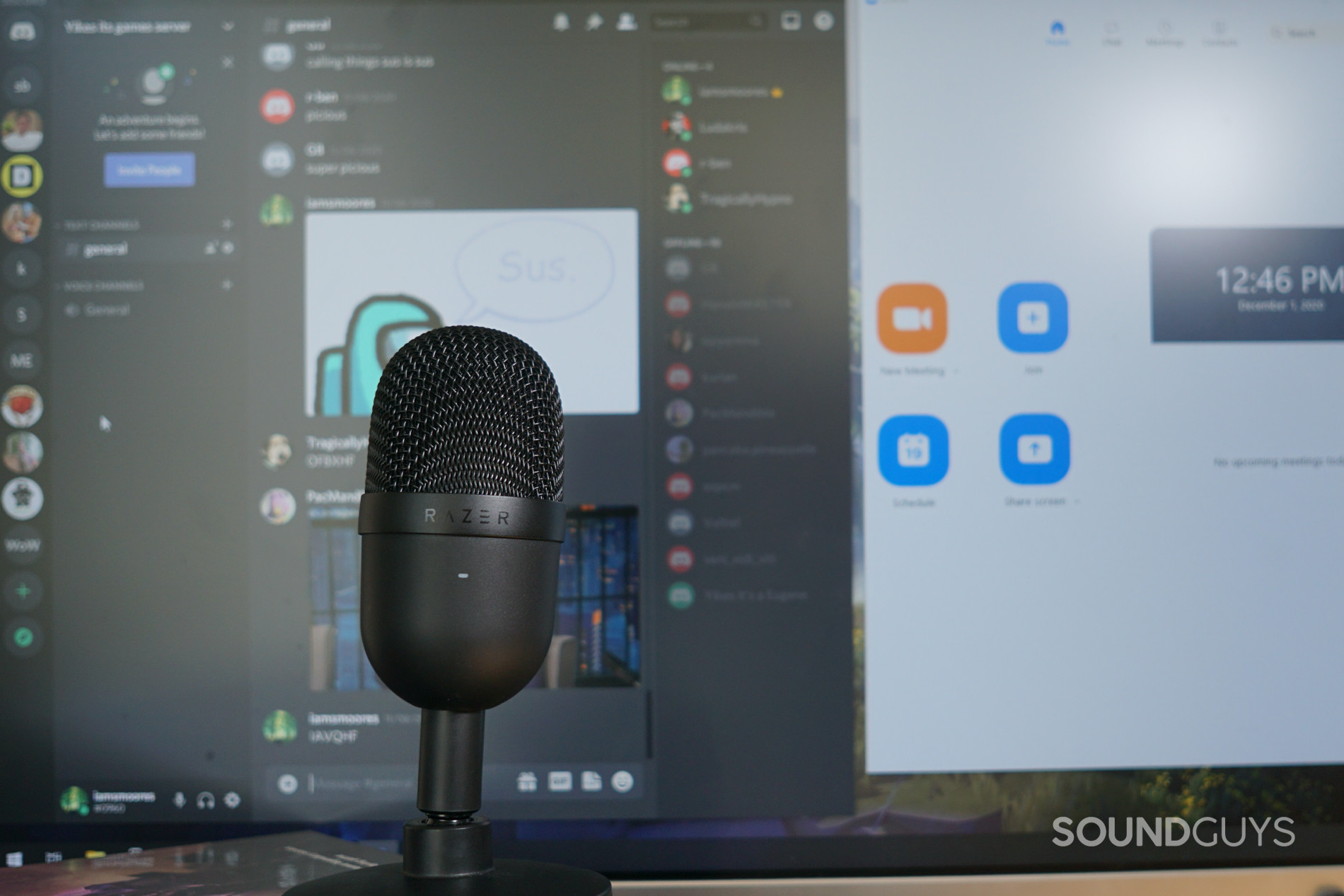 Razer Seiren Mini against a background of a computer with Discord and Zoom displayed on the monitor.