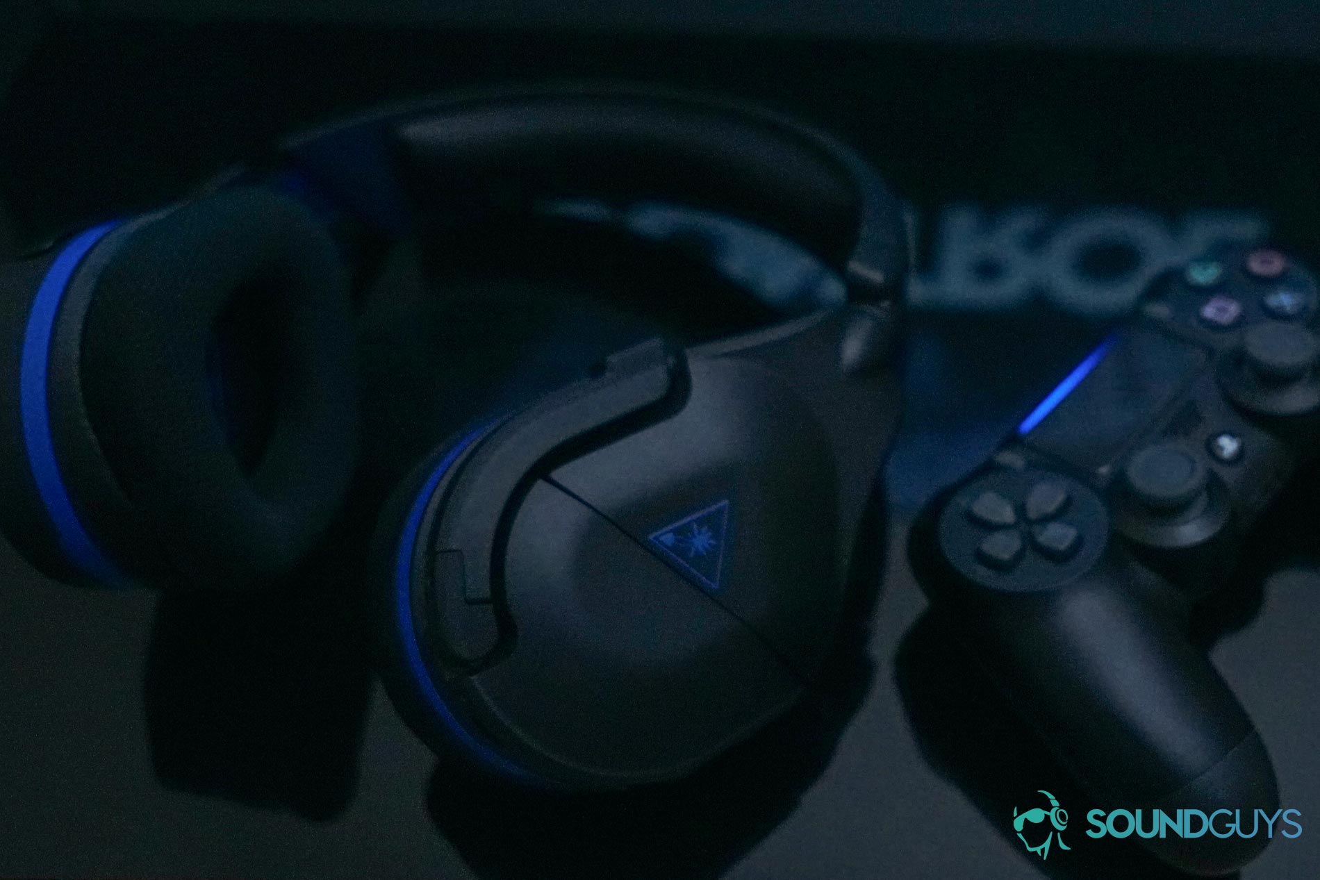 The Turtle Beach Stealth 600 Gen 2 gaming headset next to a playStation 4 DualShock controller.
