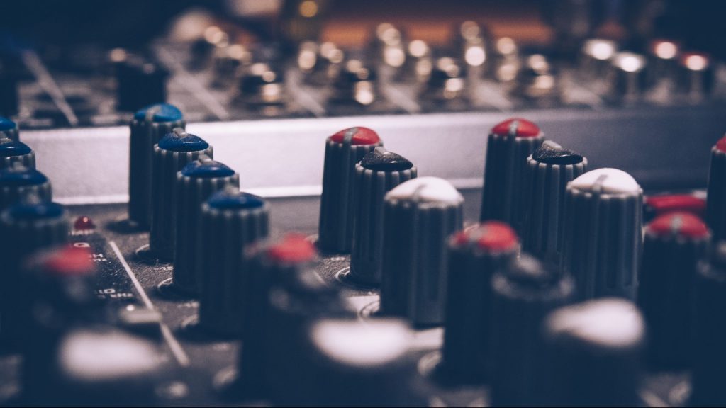 Audio mixer knobs close up.