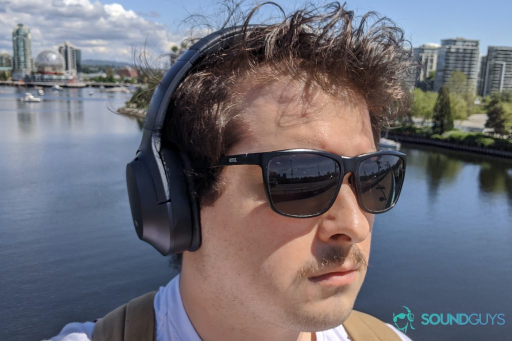 A man wearing the Razer Opus walks across the Cambie Street Bridge in Vancouver, BC, Canada.