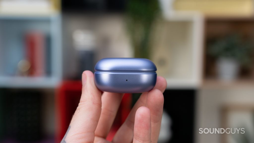 Man holding Samsung Galaxy Buds Pro charging case viewed from the front.