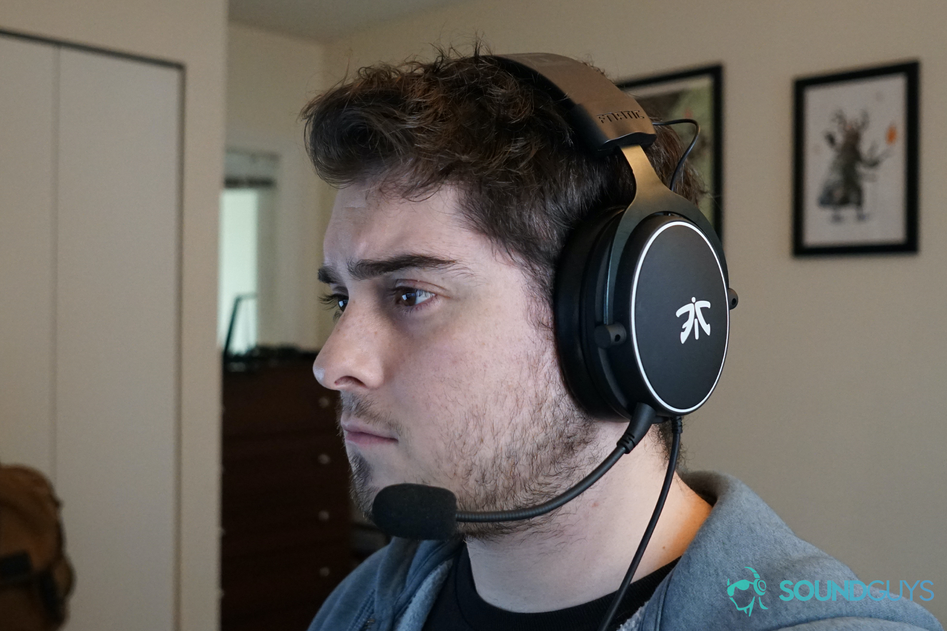 a man wears the fnatic react gaming headset