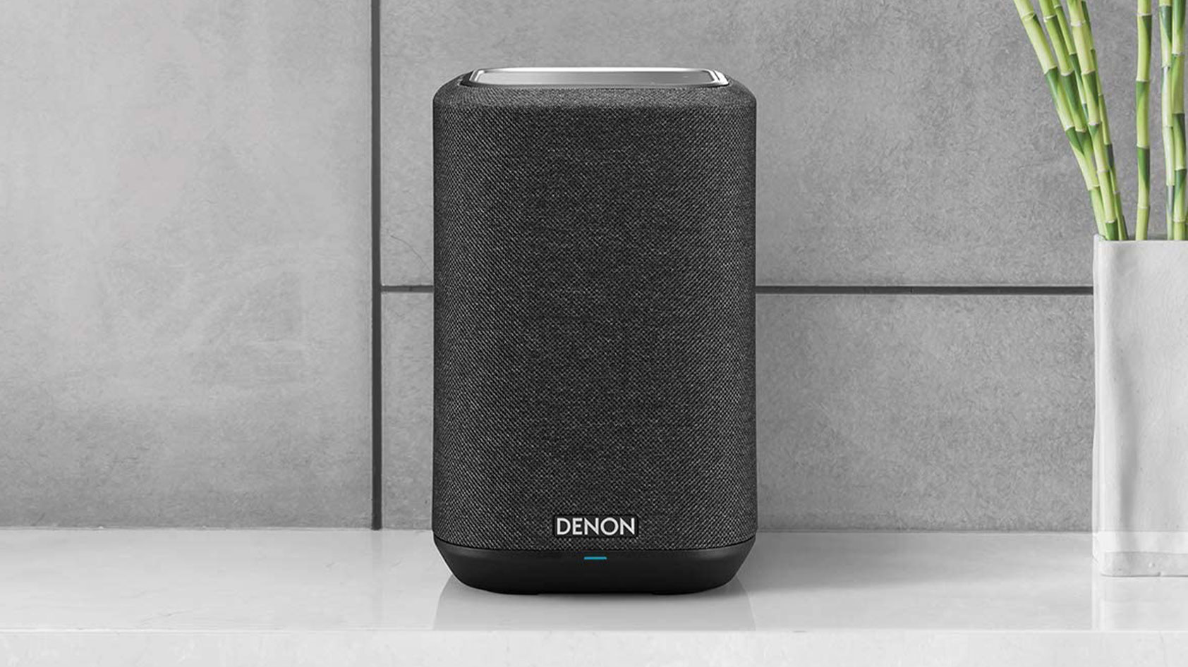 Image of a Denon Home 150 Wireless speaker on a countertop