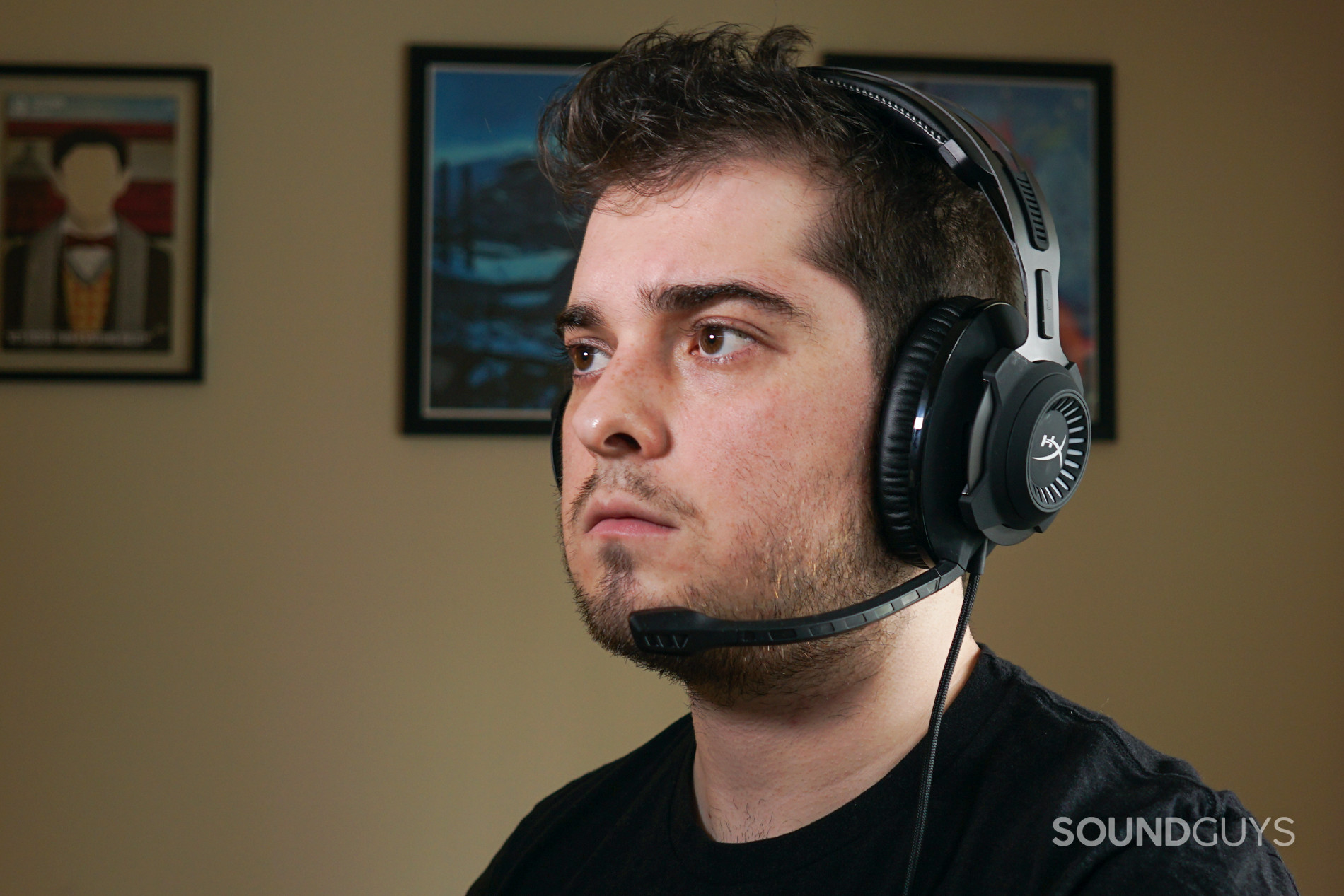 HyperX Cloud Revolver headshot 2 A man wears the HyperX Cloud Revolver + 7.1 gaming headset sitting at a PC