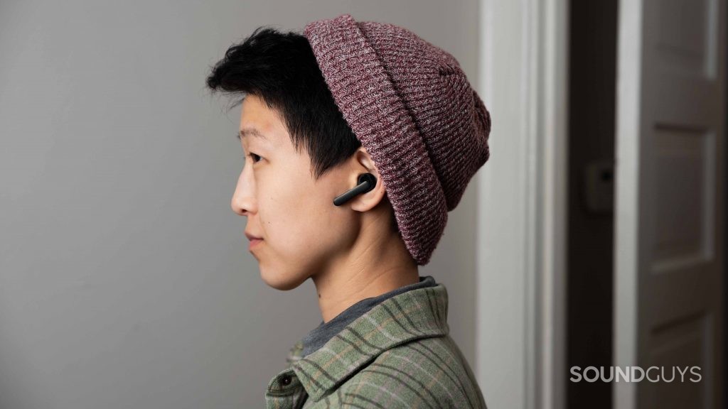 A woman wears the Mobvoi Earbuds Gesture true wireless earbuds in profile to illustrate the stemmed design.