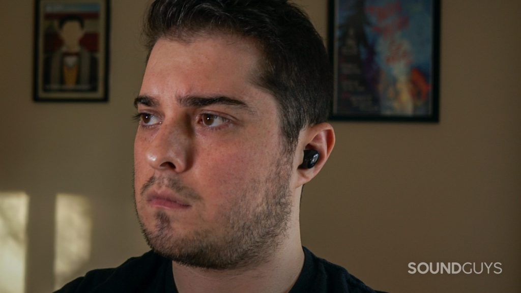 A man wears the Samsung Galaxy Buds Pro true wireless earbuds