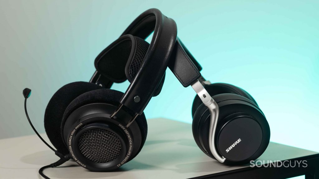 The Philips Fidelio X2 open-back headphones lean against the Shure AONIC 50 Bluetooth headphones with noise cancelling.