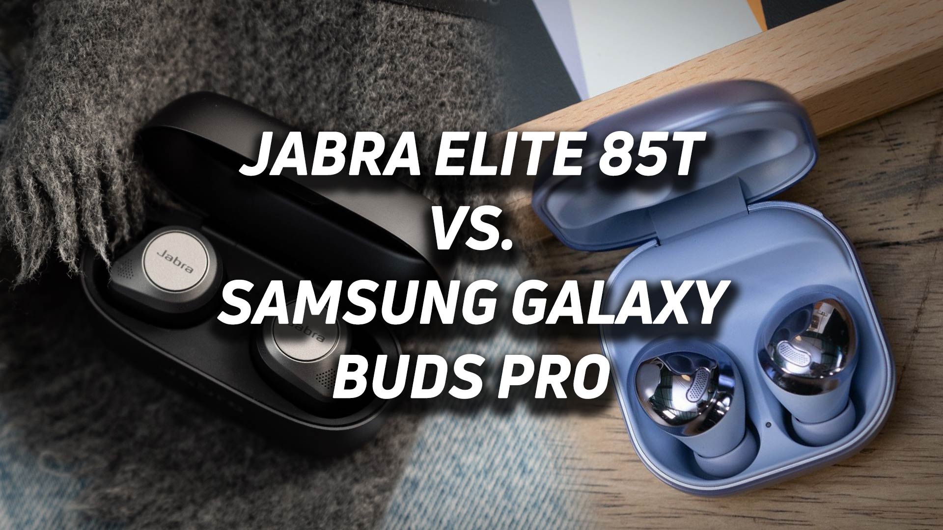The Jabra Elite 85t and Samsung Galaxy Buds Pro noises canceling headphones blended together into one image with versus text overlaid.