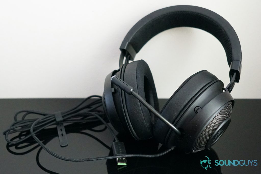 The Razer Kraken Ultimate sits on a reflective surface.
