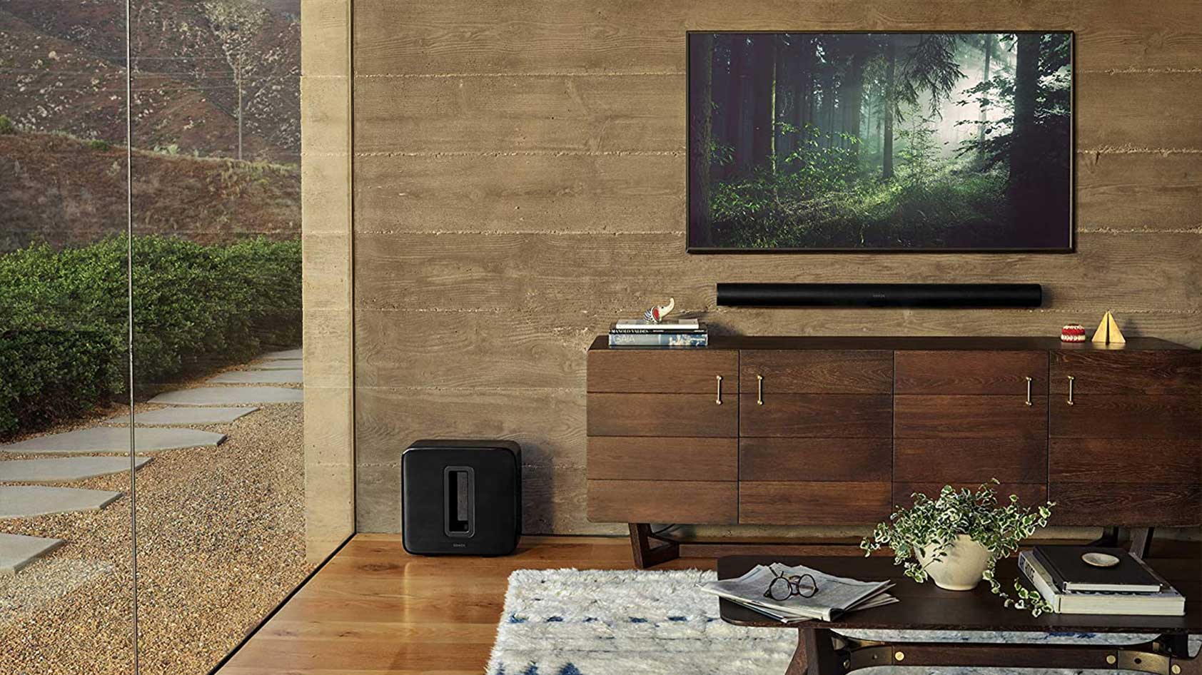 The Sonos Arc and Sonos Sub in black in a living room.