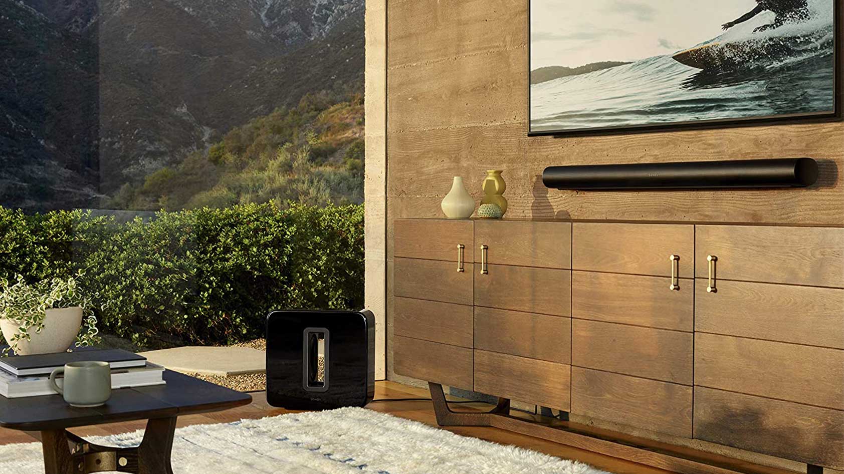 The Sonos Arc and Sonos Sub in black in a living room.