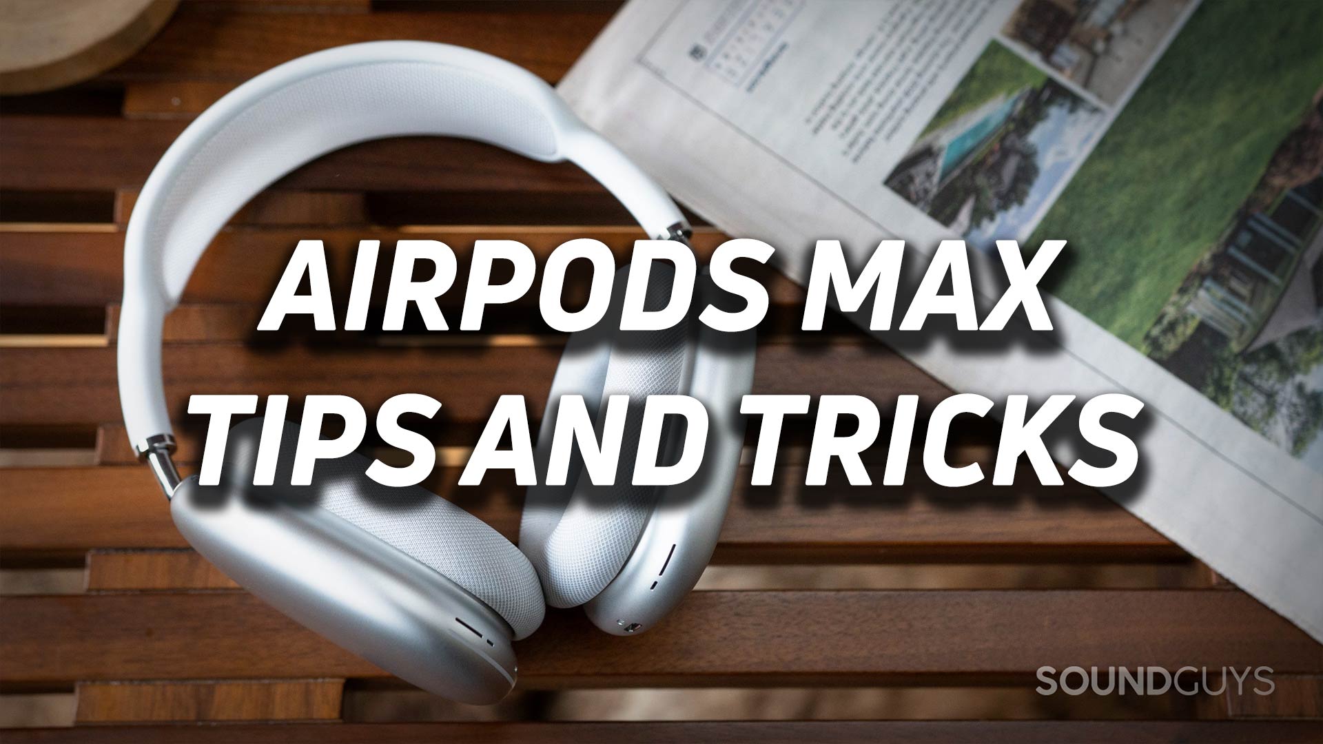 The AirPods Max in white on a wooden bench with the text "AirPods Max tips and tricks" overlaid.