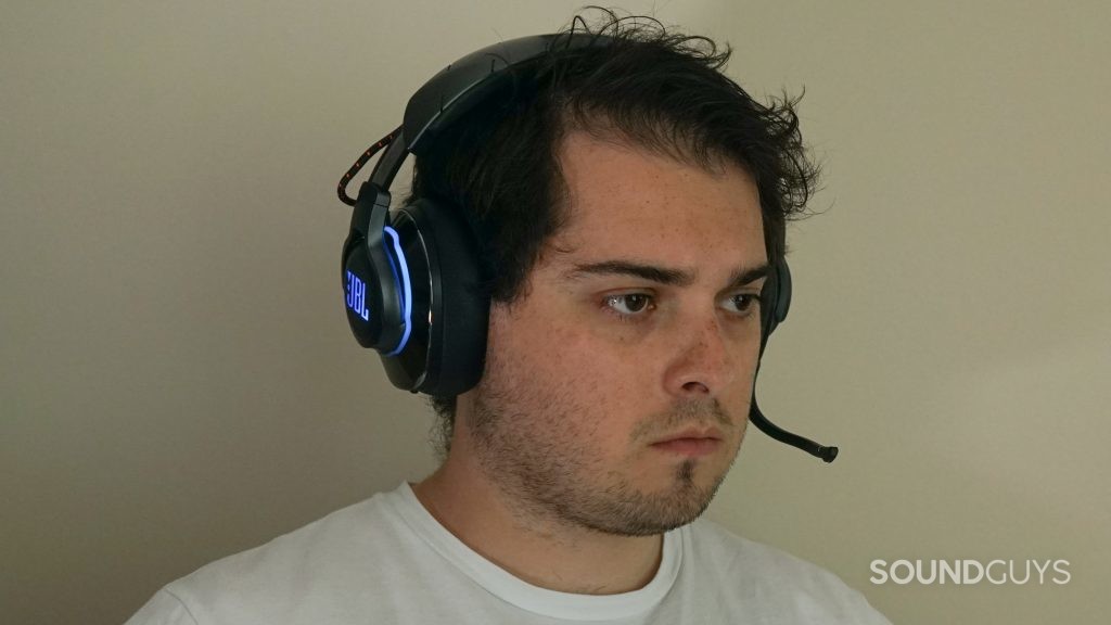 A picture of a man wearing the JBL Quantum 800 wireless gaming headset.