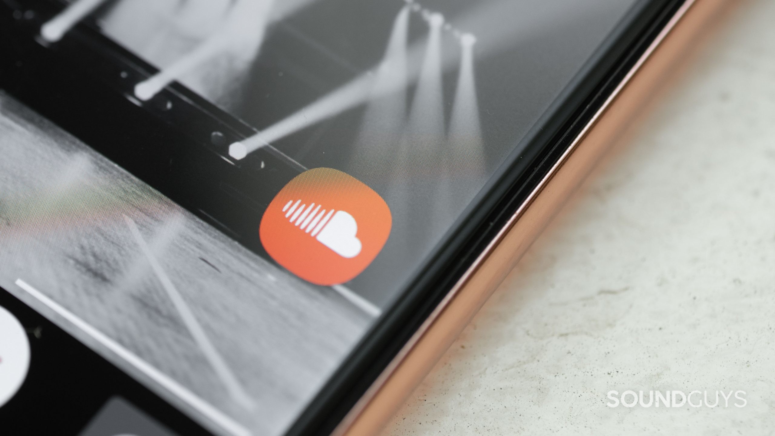 The mobile SoundCloud app icon on a smartphone display.