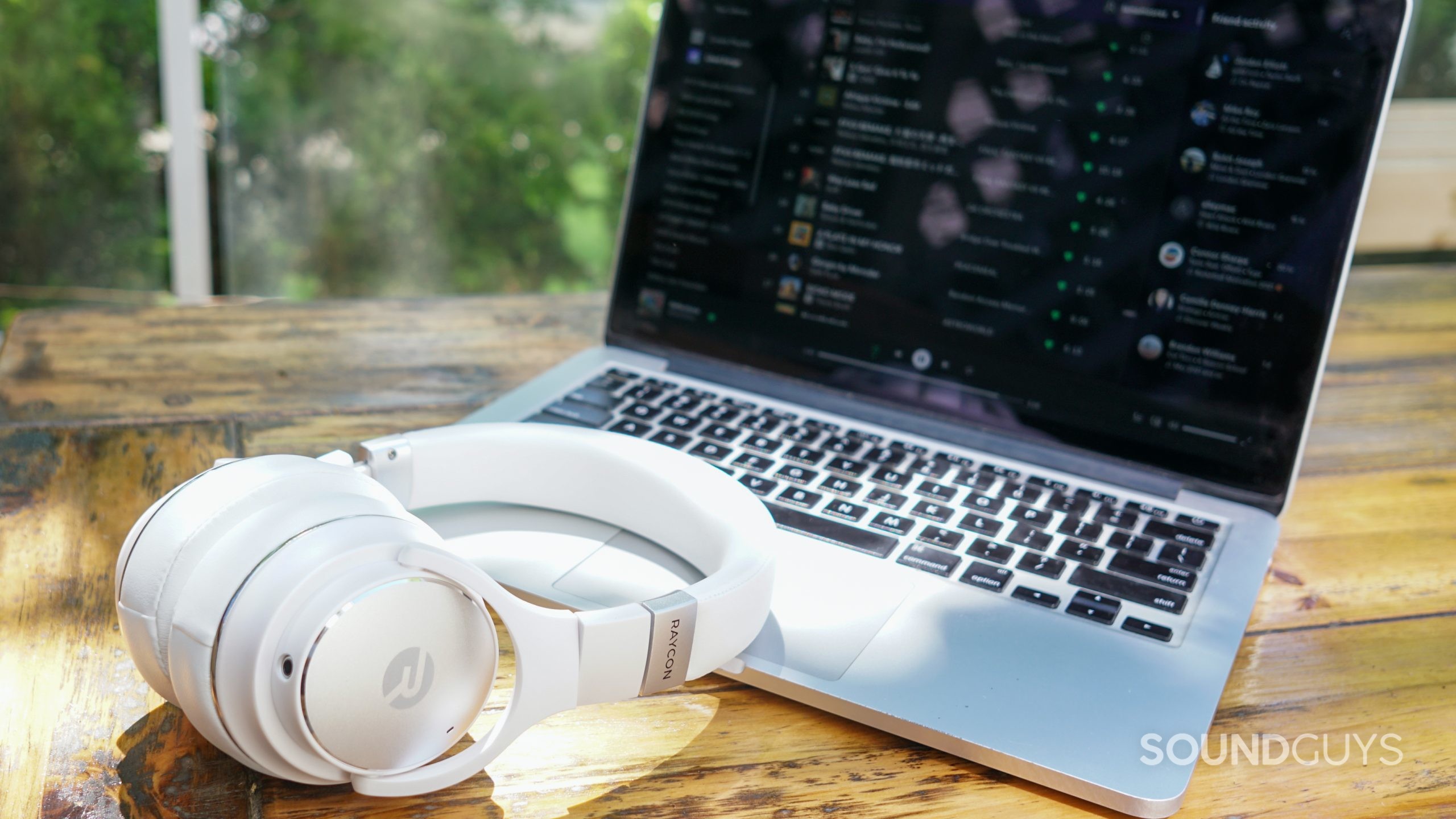 Raycon Everyday Headphones MacBook shot The Raycon Everyday Headphones lay on an Apple MacBook Pro, to which it is connected.