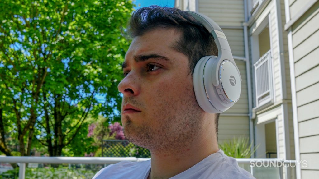 A man wears the Raycon Everyday Headphones outside