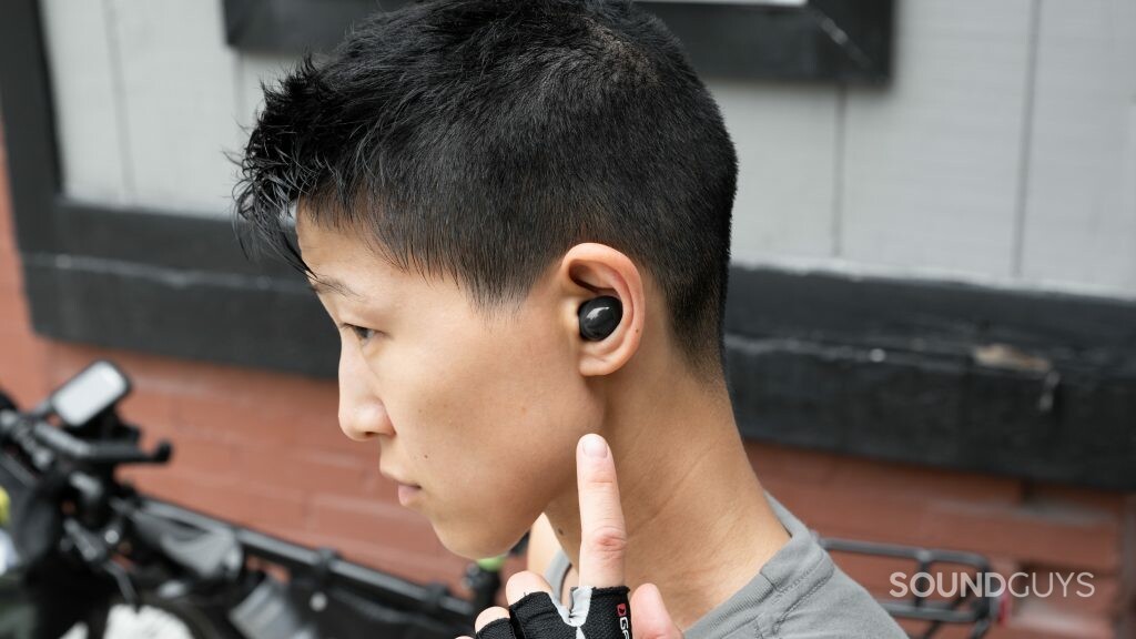 A woman wears the Samsung Galaxy Buds 2 noise cancelling true wireless earbuds.