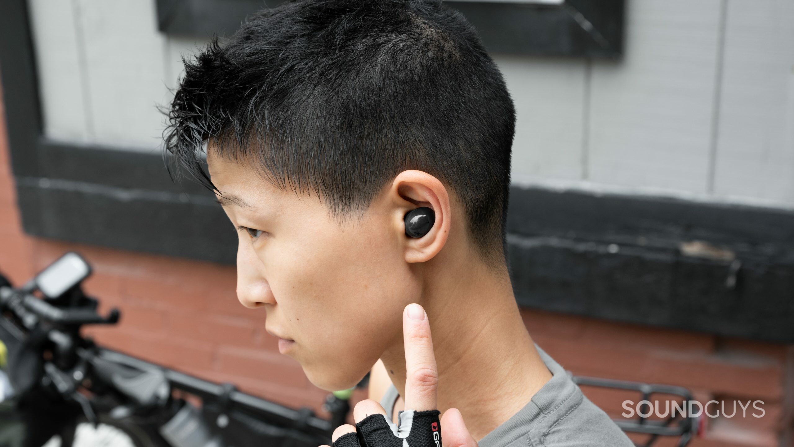 A person wears the Samsung Galaxy Buds 2 noise canceling true wireless earbuds.
