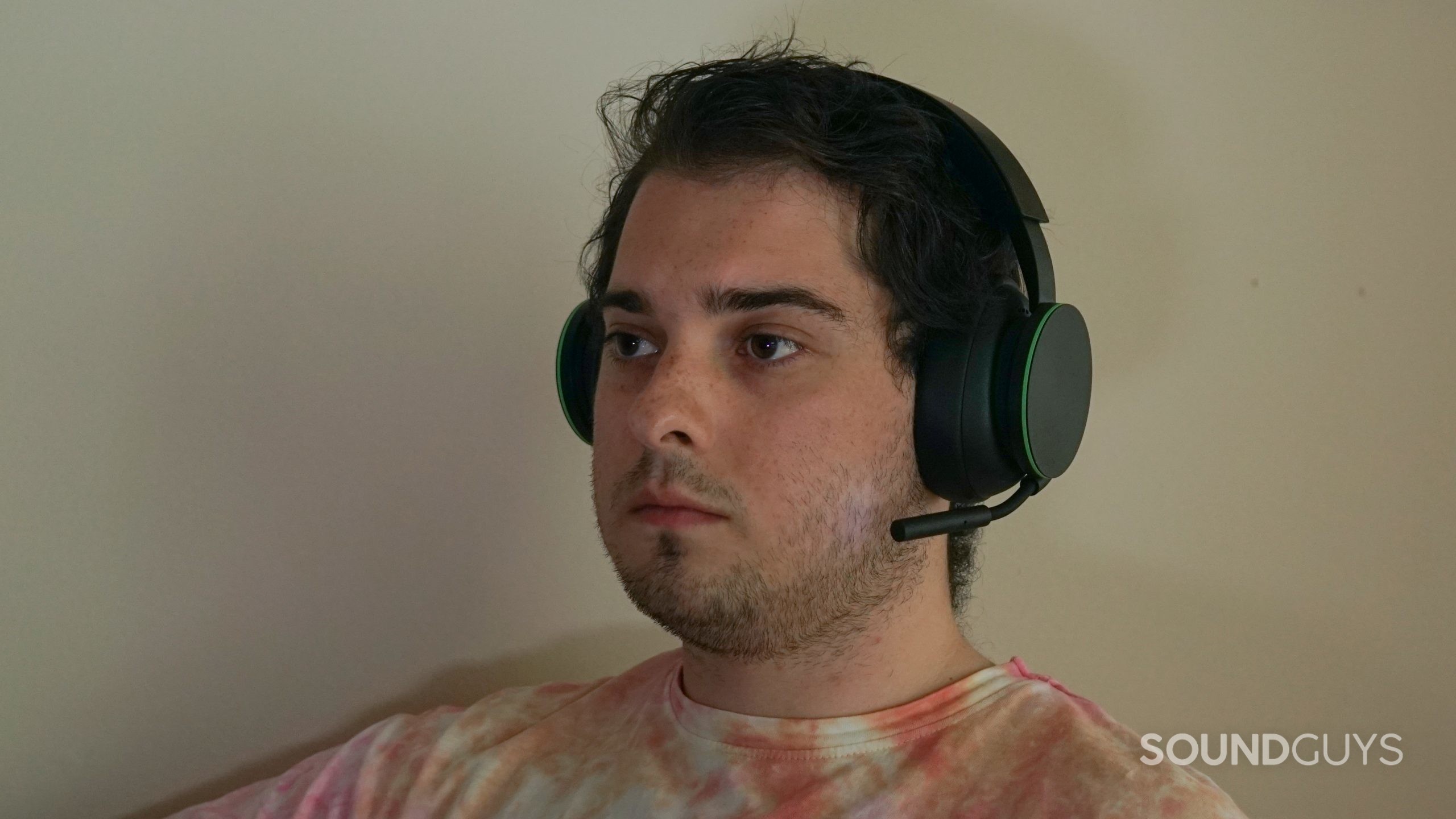 A man wears the Microsoft Xbox Wireless Headset