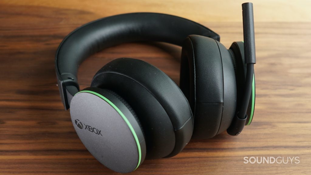 The Xbox Wireless headset lays on a wooden table