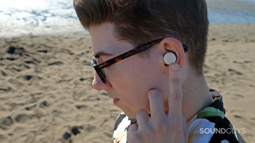 Here's a close up on a man with the Google Pixel Buds A-Series using touch controls.