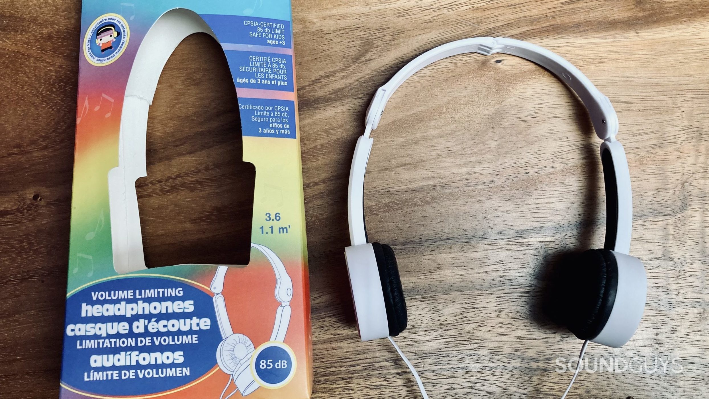 Electra volume limiting headphones on a wooden desktop