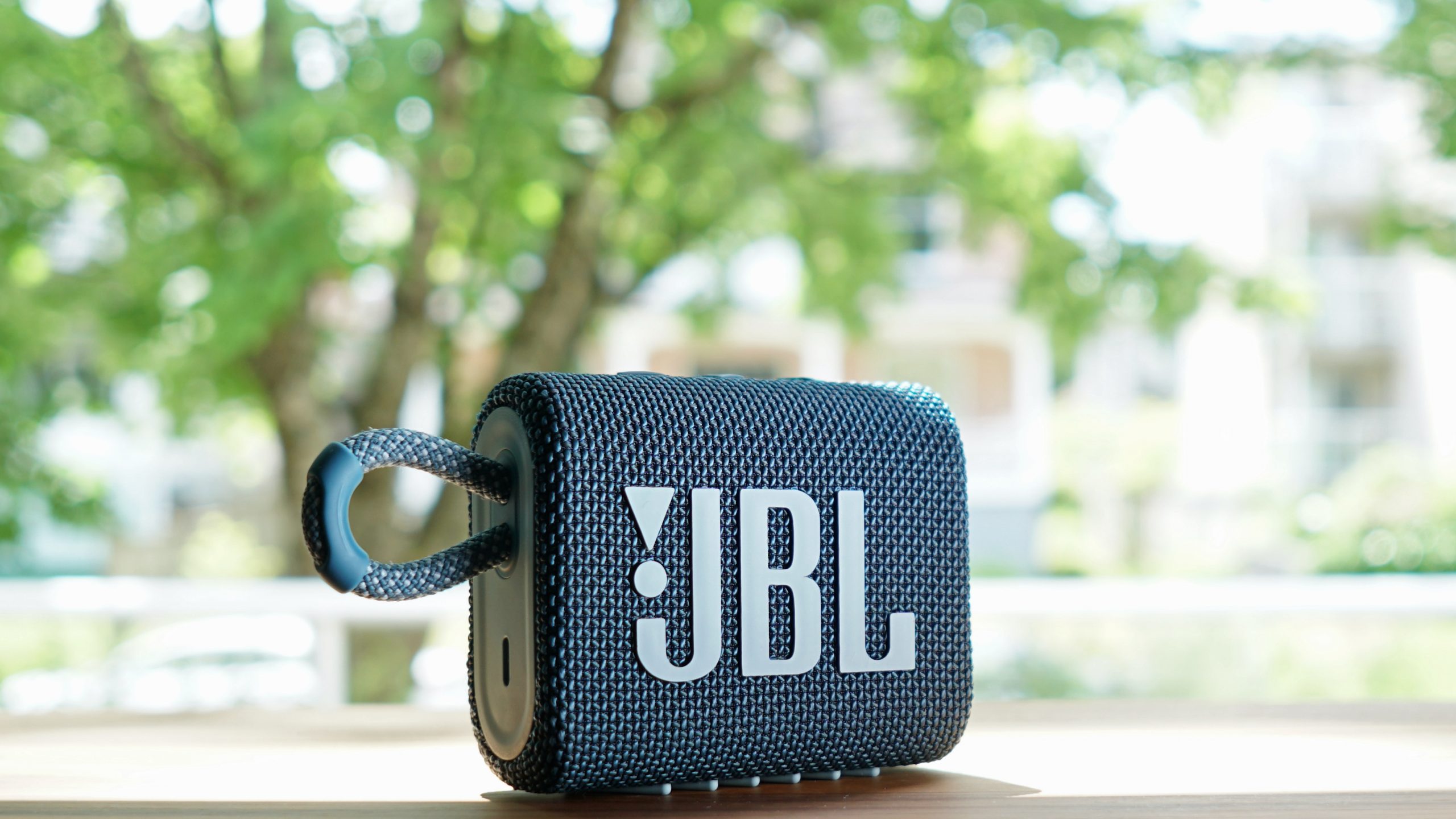 Image of a JBL Go 3 placed by a window