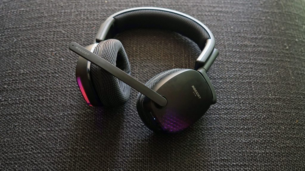 The Roccat Syn Pro Air gaming headset lays on a fabric surface.