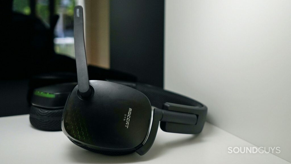 The Roccat Syn Pro Air lays on a white shelf in front of a reflective surface