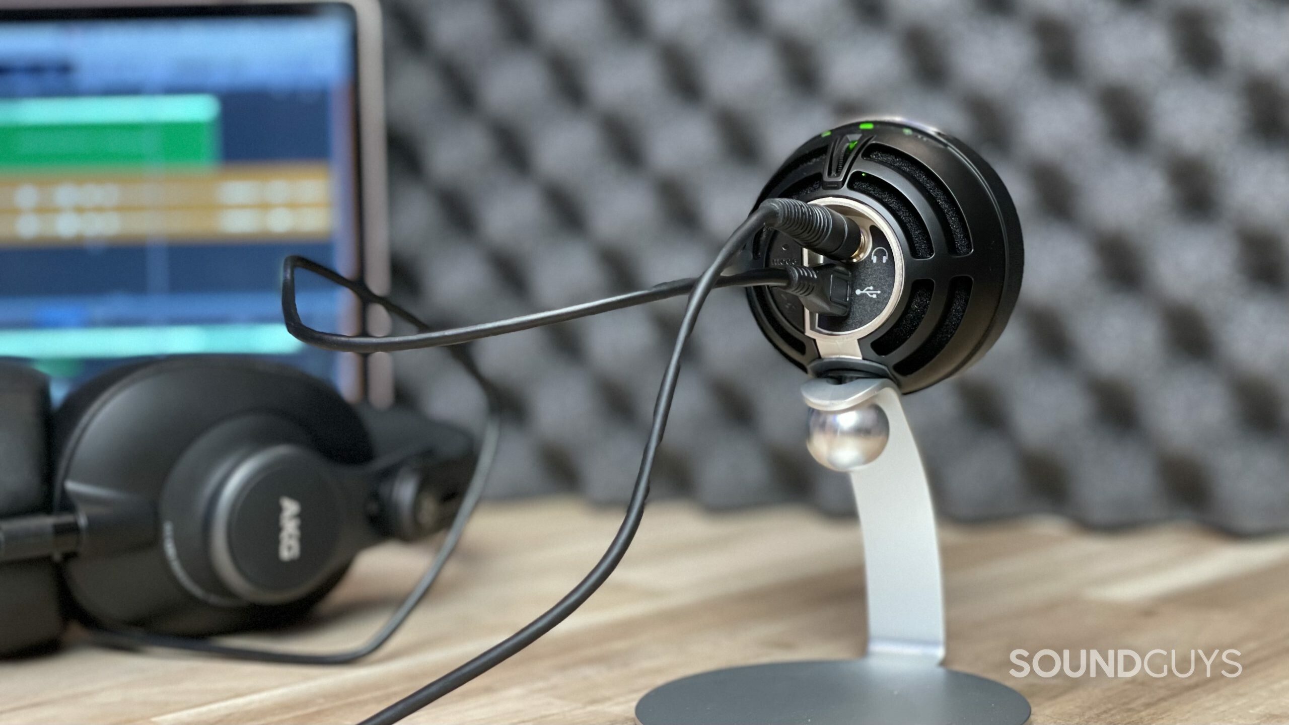 Shure MV5C desktop studio Shure MV5C in a recording studio with headphones and a laptop in the background.