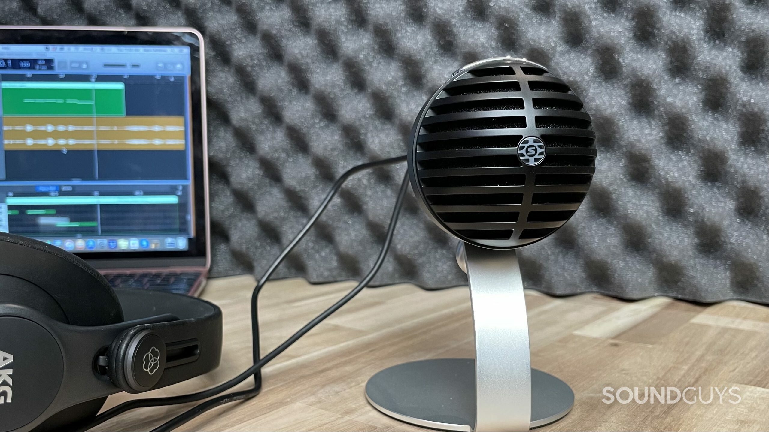 Shure MV5C laptop studio Shure MV5C in a recording studio with headphones and a laptop in the background.
