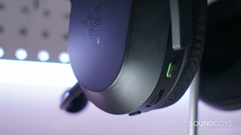A close up of the Razer Barracuda X gaming headset on a stand, with its controls in full view.
