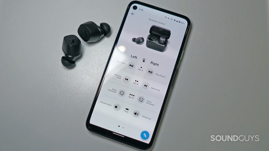 The Sennheiser CX TWS lies on a white surface next to a Google Pixel 4a running the Sennheiser Smart Control app to show how to EQ Bluetooth headphones.